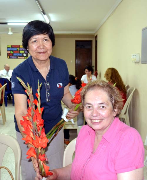 Miriam presented with a bunch of flowers