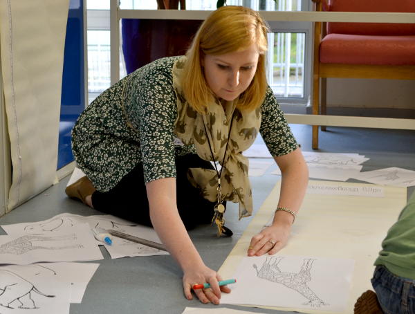 Ellen joins in an activity at Messy Church