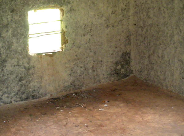Inside the old kindergarten: a bare mud floor