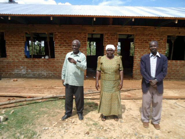 Mama Bishop (centre) is supervising the work