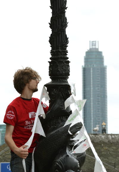 Climbing a lamppost to hang up the bunting