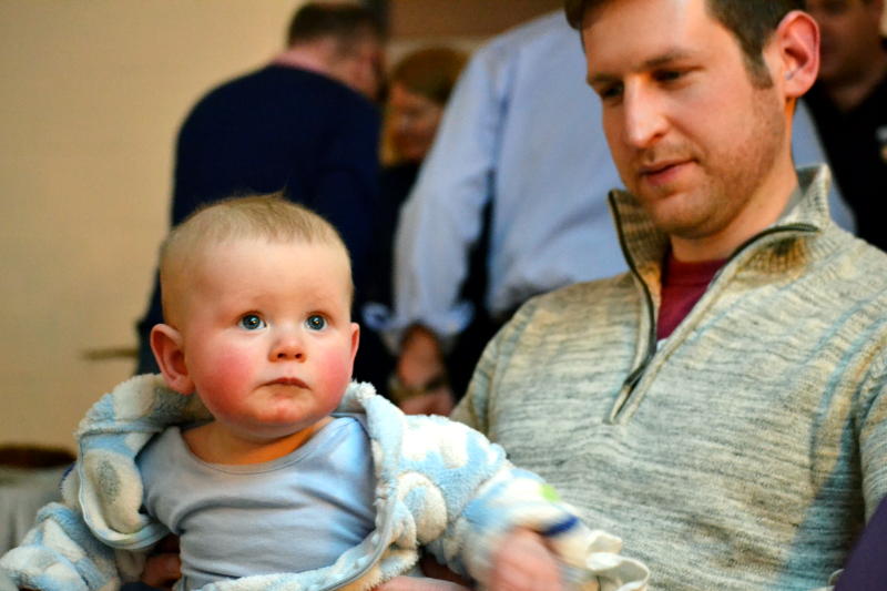 A baby looking up at a screen