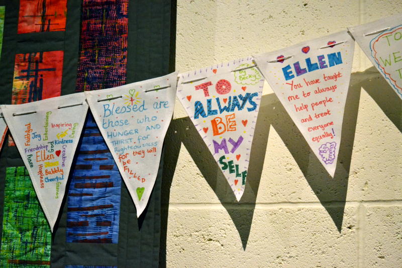 Triangular flags decorated with messages of thanks