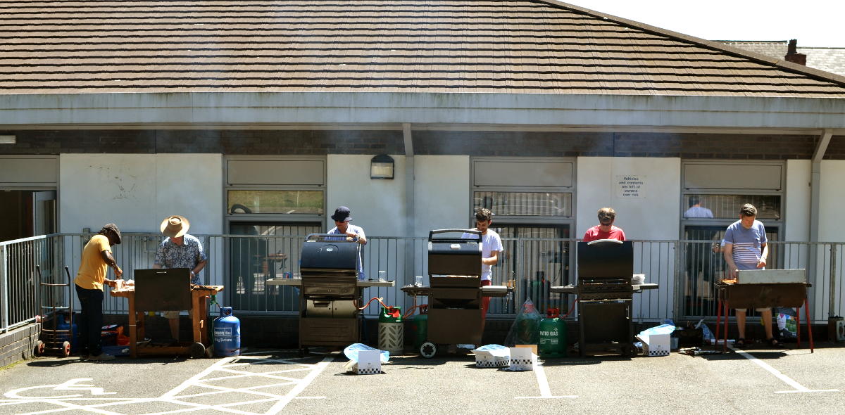 Barbecue chefs in a row