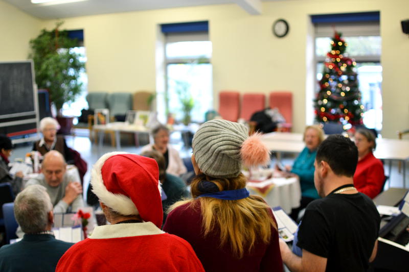 Singers leading Christmas carols