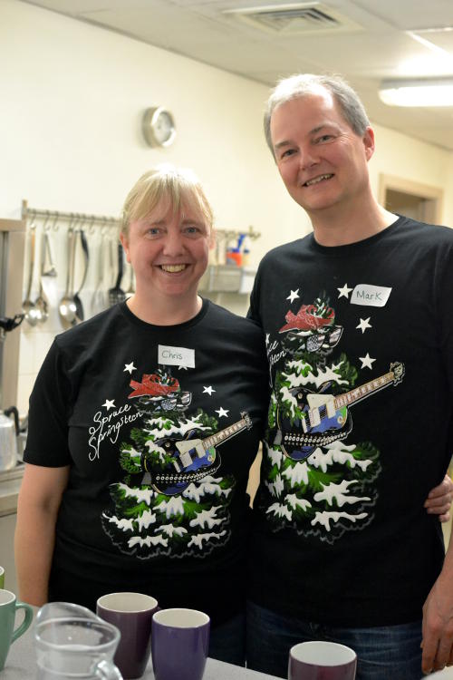 Serving drinks wearing Christmas T-shirts