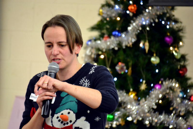 Rachel speaking in front of the Christmas tree