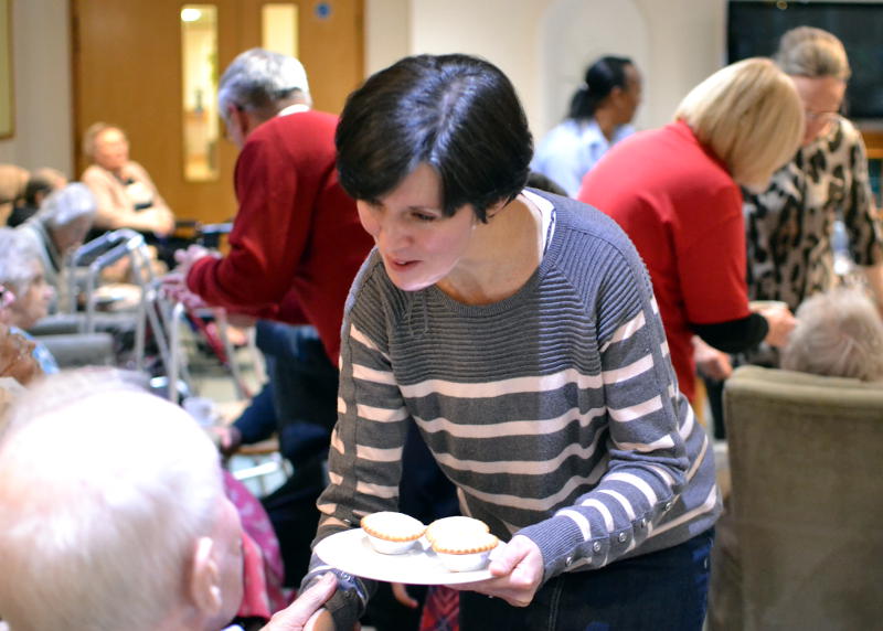 Serving mince pies after carol singing