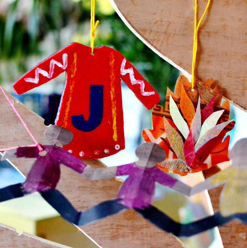 The Jesse Tree, with ornaments representing Joseph, Moses and creation