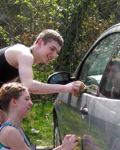 Beccy and Dan working at a fundraising car wash at Christ Church
