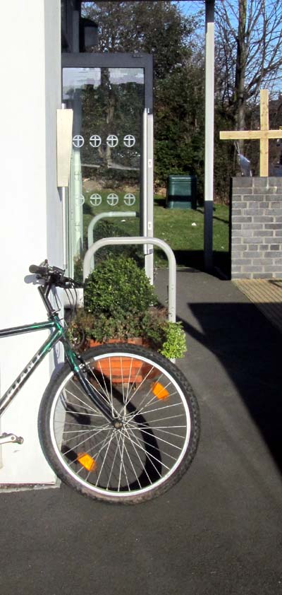 A bicycle parked next to the Christ Church entrance