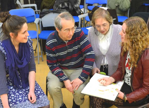 4 people holding a discussion