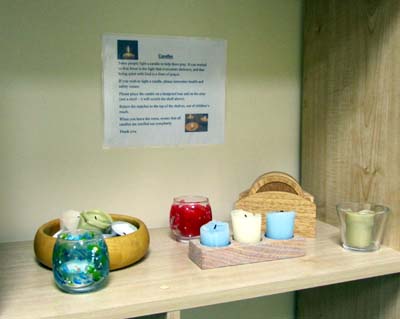 Candles and small stones on a shelf