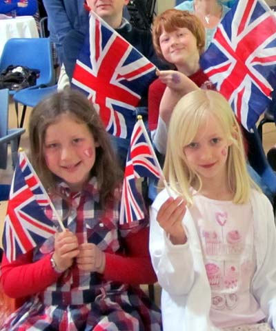 Younger spectators wave Union flags