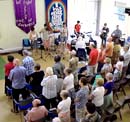 Aerial view of a congregation standing to sing