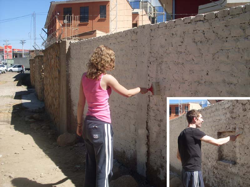 beccy and Dan painting a wall
