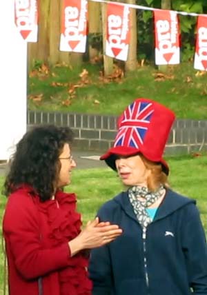 A woman wearing a Union Flag hat