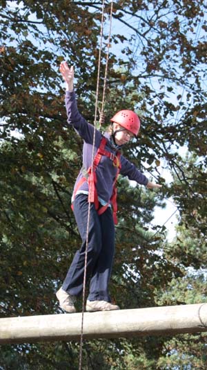 Balancing on a wooden beam high in the air