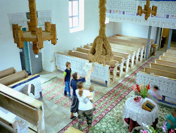 Looking down from a balcony into the interior of a church