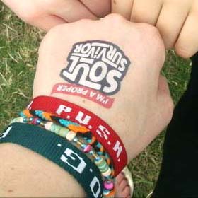 A hand and wrist with several wristbands