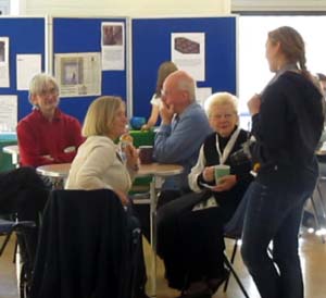 A group of adults sitting round a table