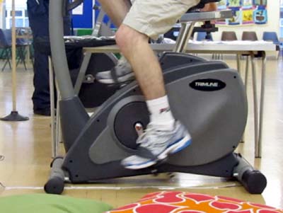 Closeup of the pedals on an exercise bike